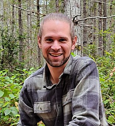 Andy Morgan, founder of AEO For Good, in a forest